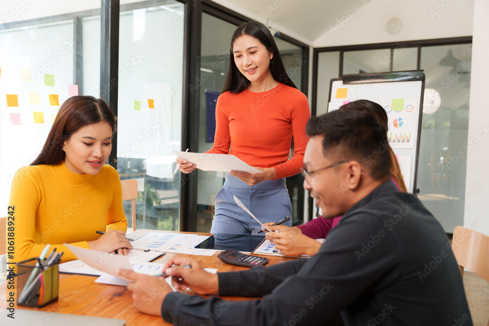 Group of Asian businessmen are sitting in a meeting, talking, exchanging knowledge. Presentation about office work Group of Asian businessmen are sitting in a meeting, talking, exchanging knowledge. Presentation about office work