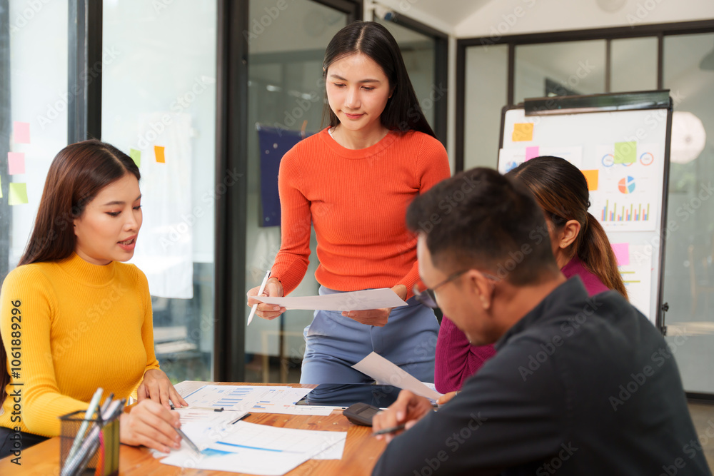 Group of Asian businessmen are sitting in a meeting, talking, exchanging knowledge. Presentation about office work Group of Asian businessmen are sitting in a meeting, talking, exchanging knowledge. Presentation about office work