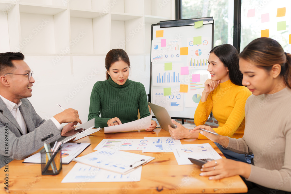 Fototapeta premium Group of Asian businessmen are sitting in a meeting, talking, exchanging knowledge. Presentation about office work