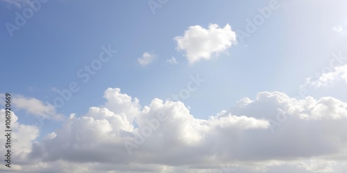 Fluffy white clouds floating in a clear blue sky on a sunny day, clouds, white