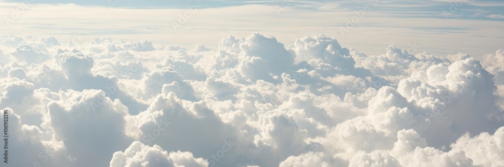 Fluffy white clouds floating in a vibrant blue sky on a sunny day, natural beauty, sky Fluffy white clouds floating in a vibrant blue sky on a sunny day, natural beauty, sky