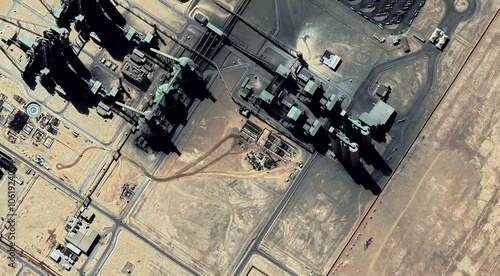 Tableau sur toile The landscape of a sandy desert and an oil plant in Qatar from a bird's eye view
