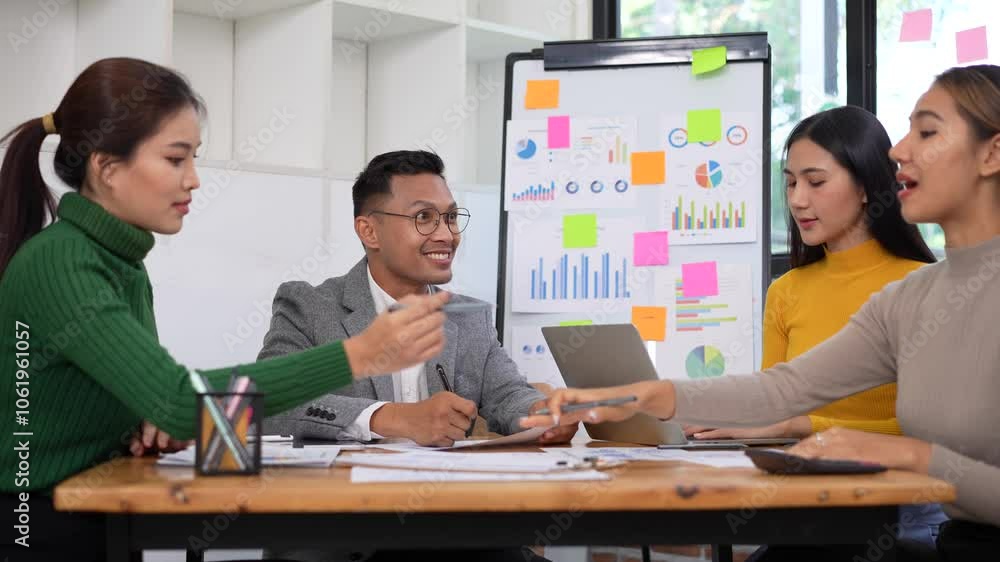 Efficient teamwork and collaboration among professionals in office, focusing on data analysis and discussion strategies with laptops and charts. Efficient teamwork and collaboration among professionals in office, focusing on data analysis and discussion strategies with laptops and charts.