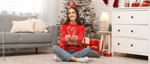 Young woman in sweater with...