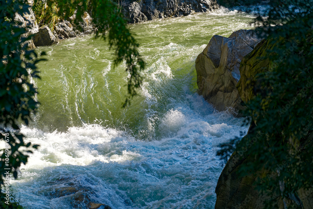 Obraz premium High angle view of Passer Passirio River at gorge of Italian City of Meran on a sunny summer day. Photo taken July 18th, 2024, Merano Meran, Italy.