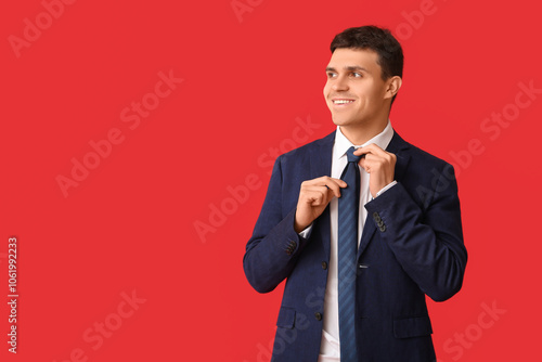 Smiling young man straighte...