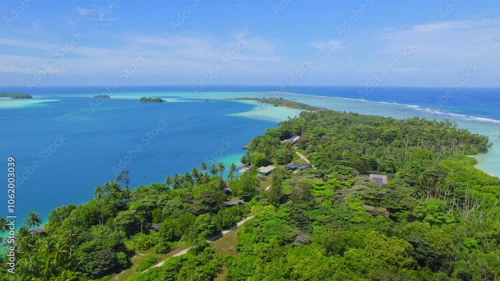 Aerial shot descending towards tropical island and buildings on Palmyra Atoll, Pacific Ocean Aerial shot descending towards tropical island and buildings on Palmyra Atoll, Pacific Ocean