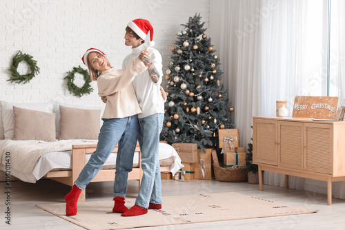 Joyful young couple dancing...