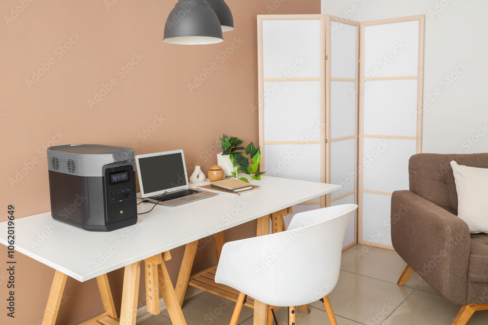 Fototapeta premium Interior of office with workplace, armchair and portable power station