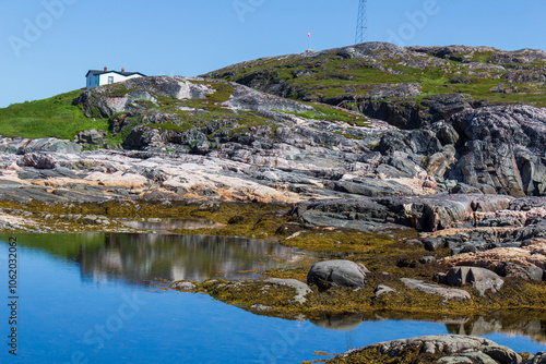 Scenic Coastal Landscape With Rugged Cliffs And Calm Waters