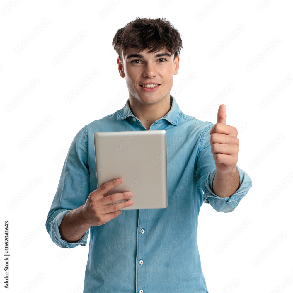 happy young man holding tablet and making thumbs up gesture happy young man holding tablet and making thumbs up gesture