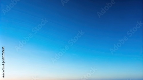 Background of a clear sky with a soft blue gradient and no clouds reflected