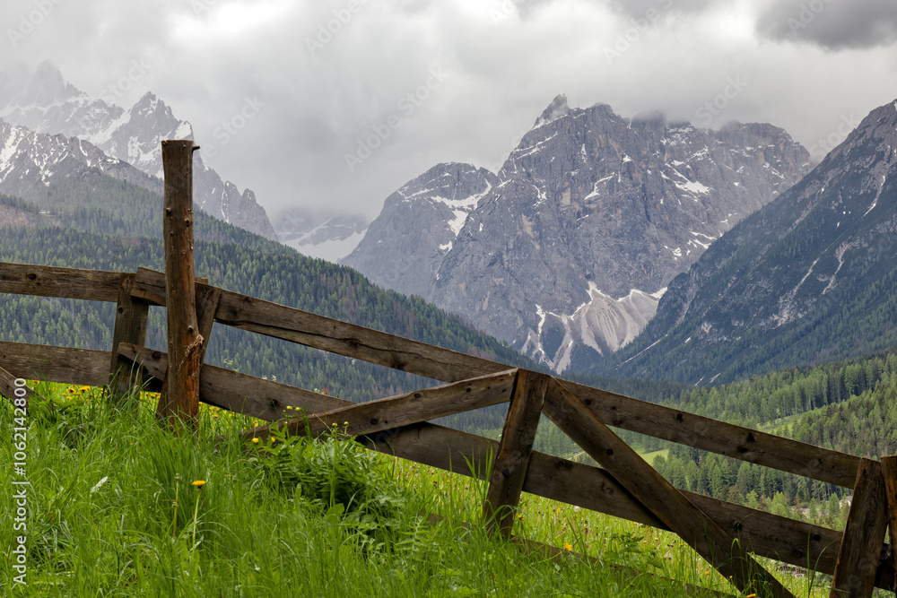 Snow covered peaks of the Sesto Dolomites in clouds, mountains of the Alps, South Tyrol, Italy, Europe Snow covered peaks of the Sesto Dolomites in clouds, mountains of the Alps, South Tyrol, Italy, Europe