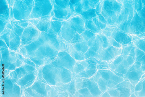 Clear blue water rippling under sunlight creates a serene pool atmosphere