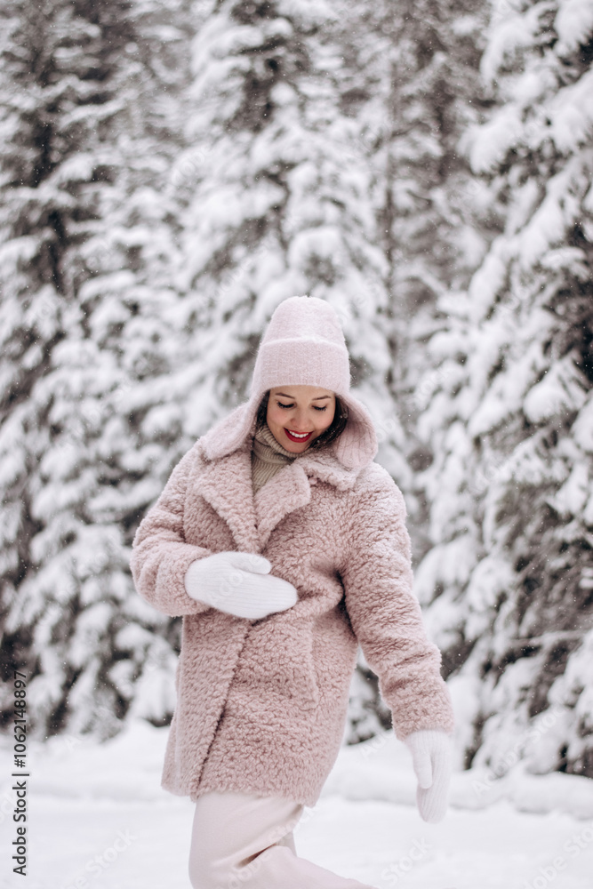 Young happy attractive woman in a light hat and fur coat in a winter forest. Winter concept. Young happy attractive woman in a light hat and fur coat in a winter forest. Winter concept.