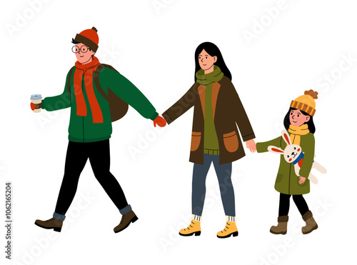 Family enjoying a winter day outdoors while holding hands and carrying warm drinks