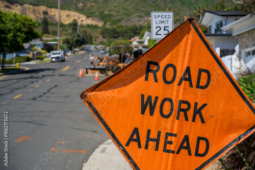 Road works digging construction in residential street.