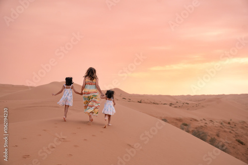 Family Enjoying Desert Sunset