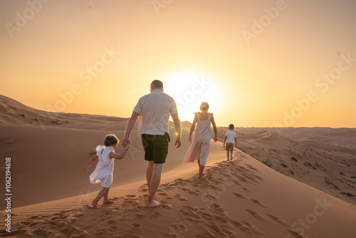 Family Enjoying Desert Sunset