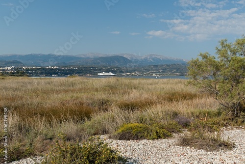 View from Alikes beach to the Corinthian Gulf, Ionian Sea and Aigio town. Peloponnese. Greece. Europe. photo