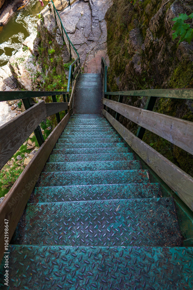 Steep Metal Staircase in a Rocky Outdoor Setting Steep Metal Staircase in a Rocky Outdoor Setting