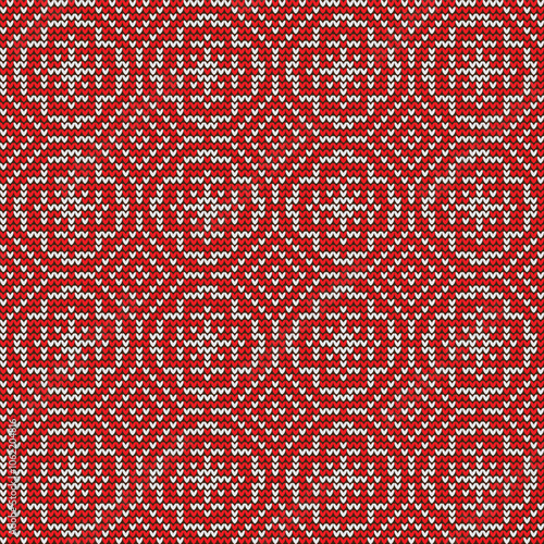 Red and white knitted geometric ethnic pattern. Seamless ornament. Vector illustration. Holiday pattern.
