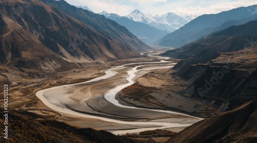 Panoramic view of winding Tibetan river; use earthy, muted palette 