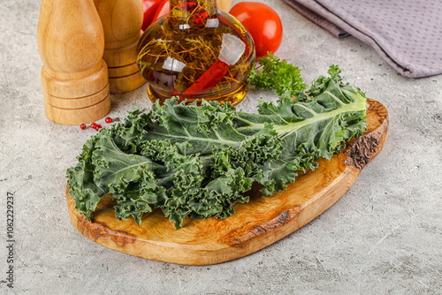 Green Kale cabbage leaves ocer board photo