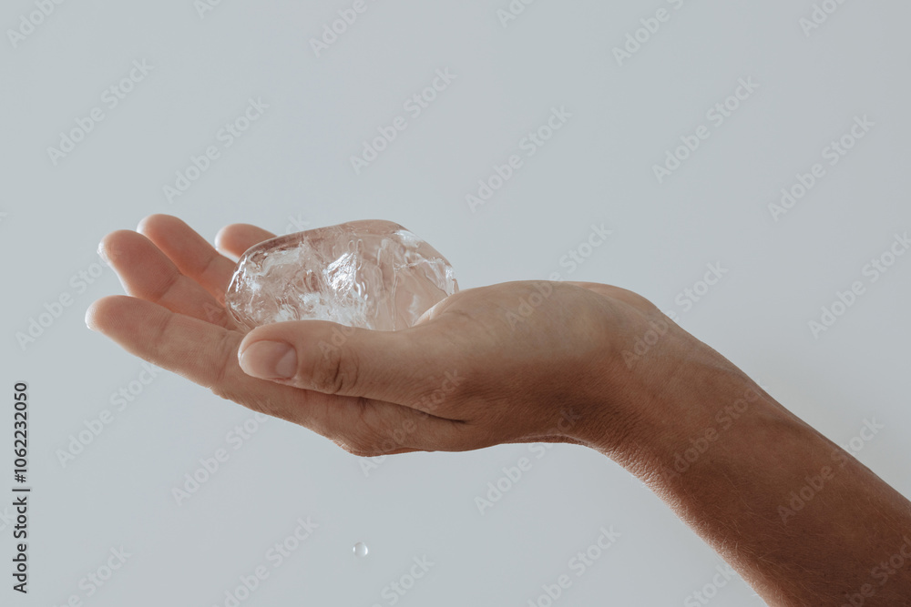 Close-up of hand gently holding a clear piece of ice Close-up of hand gently holding a clear piece of ice