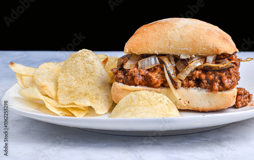 sloppy joe and onions  on a ciabatta roll photo