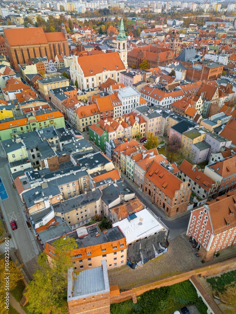 Naklejka premium Aerial view of historical buildings and roofs in Polish medieval town of Torun where Nicolaus Copernicus was born.