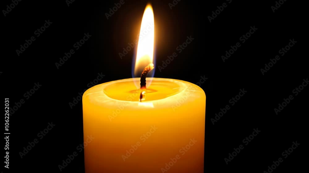A glowing yellow candle with a flame, illuminating its surroundings against a dark background. A glowing yellow candle with a flame, illuminating its surroundings against a dark background.