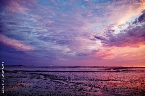 Purple sunset over the Dollart at low tide, East Frisia, Lower Saxony, Germany photo