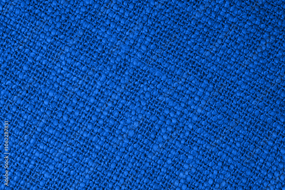 Close-up texture of woven blue fabric, ideal for backgrounds, textile design, and upholstery projects. Close-up texture of woven blue fabric, ideal for backgrounds, textile design, and upholstery projects.