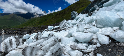 Melting of a mountain glacier and large blocks of snow on the Alibek glacier in Dombai, in the Karachay-Cherkess Republic, Russia.