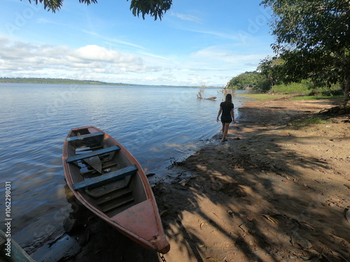 mulher caminhando nas margens do rio xingu, em altamira, pará  photo