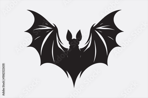 A black silhouette of a flying bat with outstretched wings.