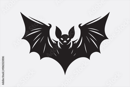 A black silhouette of a flying bat with outstretched wings.