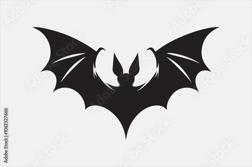 A black silhouette of a flying bat with outstretched wings.