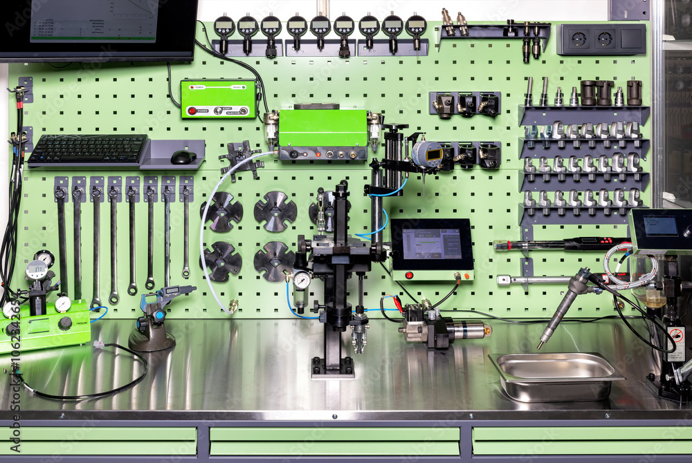 Advanced diagnostic tools and modern industrial equipment in workshop setup in an organized workplace, the concept of machine calibration.