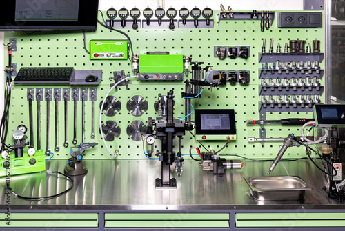 Obraz na płótnie Advanced diagnostic tools and modern industrial equipment in workshop setup in an organized workplace, the concept of machine calibration. w salonie