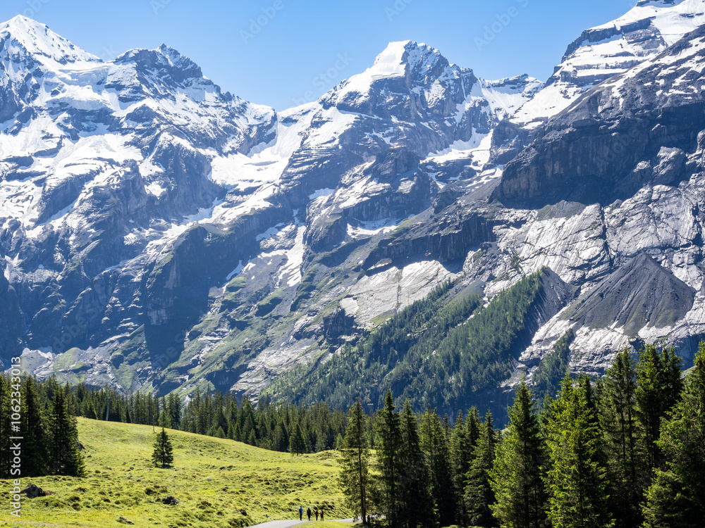 Obraz premium Oeschinen lake hike and surrounding peaks and waterfalls , Switzerland