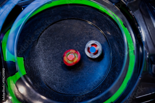 Beyblade battle of spinning toys in a fight of a Japanese origin game photo