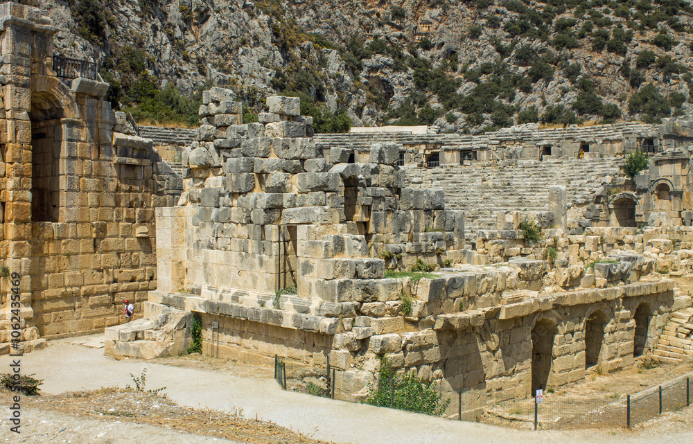 MIRA, ANTALYA, TURKEY - architectural ruins with theatrical masks in the ruins of an ancient city on a sunny summer day