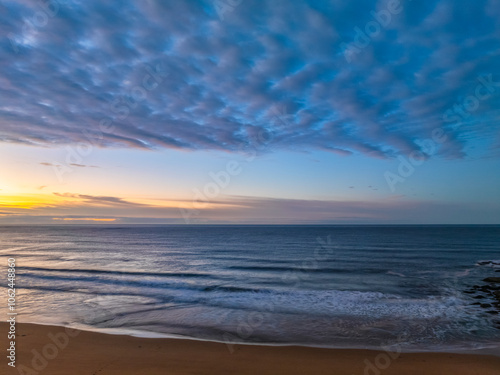 Winter seascape views over the beach with high and medium cloud cover photo