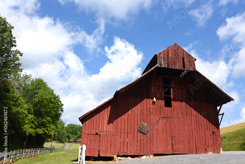 Farm Scene Includes Red Wooden Barn photo