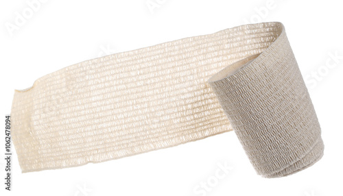 фотографія Elastic medical bandage roll flying, first aid isolated on white, top view
