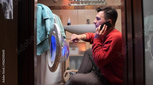 Man calling appliance repair service for washing machine breakdown