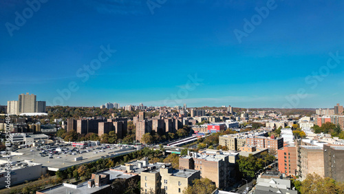 This location in the Bronx offers stunning views of lush greenery, a picturesque lake, and urban structures. Framed by the river, it showcases iconic bridges and the New York City skyline 