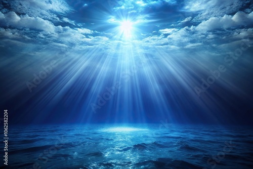 Wide-angle dark blue ocean with light beam on misty backdrop